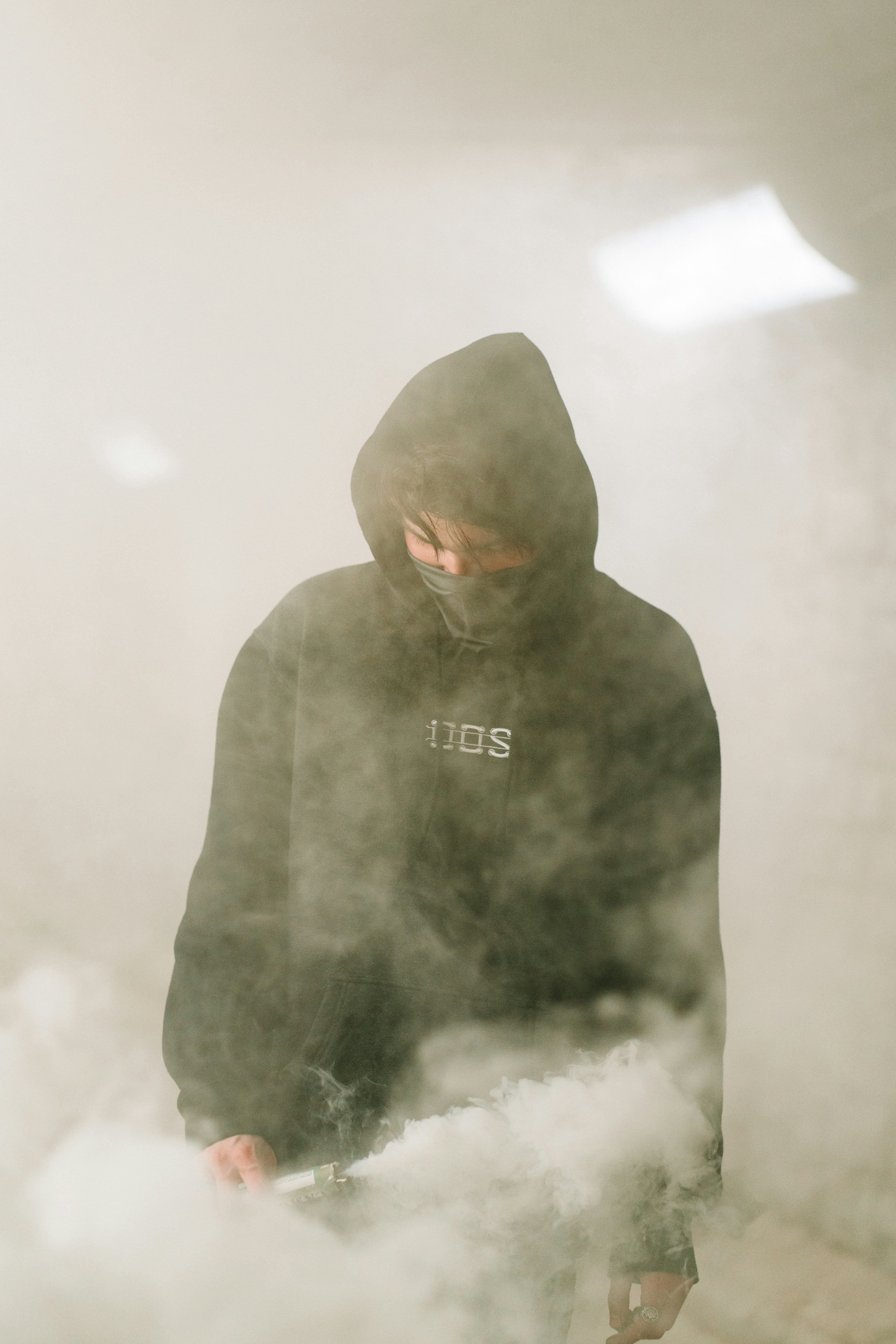 man in black hoodie standing